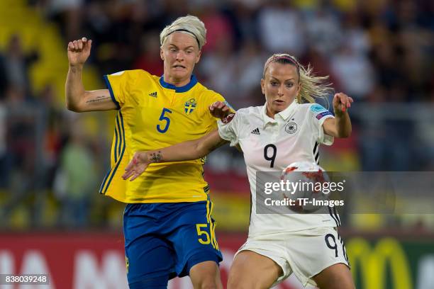 Nilla Fischer of Sweden and Mandy Islacker of Germany battle for the ball l during the Group B match between Germany and Sweden during the UEFA...