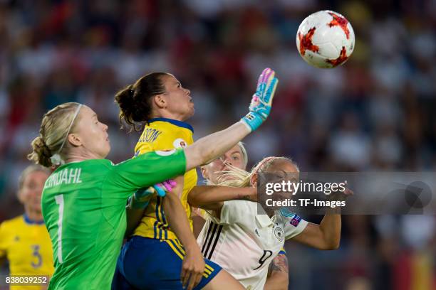 Goalkeeper Hedvig Lindahl of Sweden , Jonna Andersson of Sweden and Mandy Islacker of Germany battle for the ball l during the Group B match between...