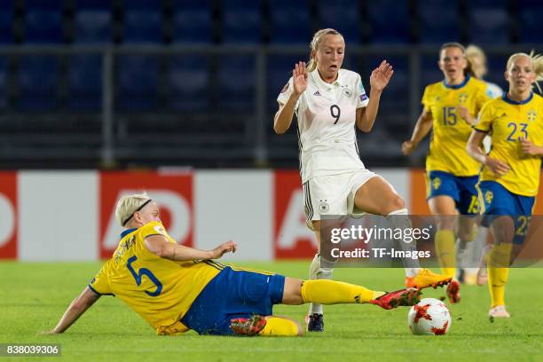 Nilla Fischer of Sweden and Mandy Islacker of Germany battle for the ball l during the Group B match between Germany and Sweden during the UEFA...