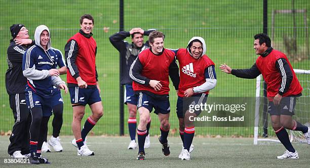 Mike Cron, Jimmy Cowan, Anthony Boric, Mils Muliaina, Richie McCaw, Ma'a Nonu and Isaia Toeava of the All Blacks celebrate a goal in a game of...