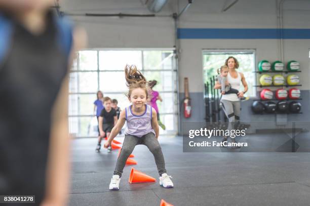 never too young to start training - young kid and barbell stock pictures, royalty-free photos & images