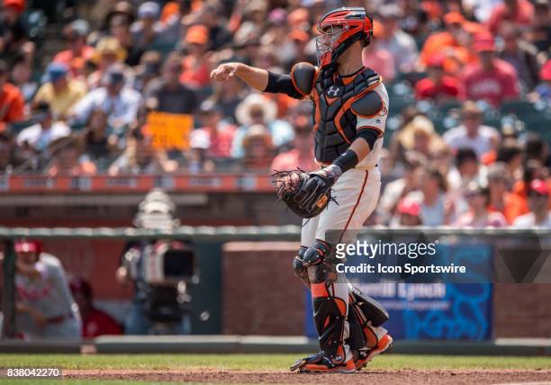 San Francisco Giants Catcher Buster Posey warming up during the San Francisco Giants versus Philadelphia Phillies Game on August 20, 2017 at AT&T...
