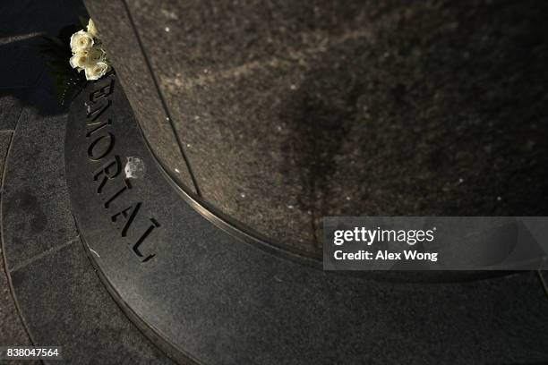 Flowers are placed during a "Black Ribbon Day" remembrance event at the Victims of Communism Memorial August 23, 2017 in Washington, DC. The Victims...