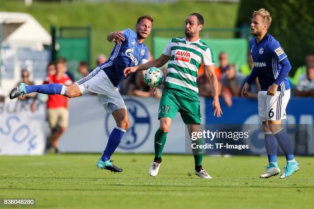 Benedikt Hoewedes of Schalke Johannes Geis of Schalke and Garcia of Eibar battle for the ball during the preseason friendly match between FC Schalke...