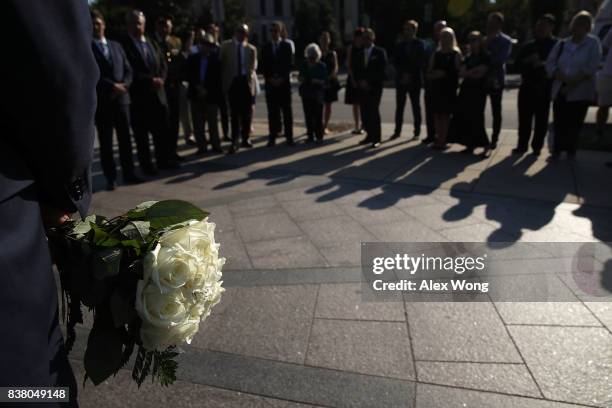 People attend a "Black Ribbon Day" remembrance event at the Victims of Communism Memorial August 23, 2017 in Washington, DC. The Victims of Communism...