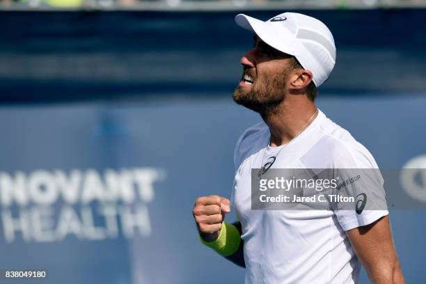 Steve Johnson reacts after a point against Yen-Hsun Lu of Chinese Taipei during the fourth day of the Winston-Salem Open at Wake Forest University on...