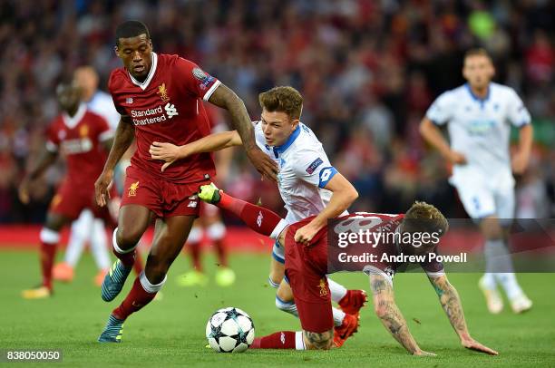 Alberto Moreno and Georginio Wijnaldum of Liverpool competes with Dennis Geiger of 1899 Hoffenheim during the UEFA Champions League Qualifying...