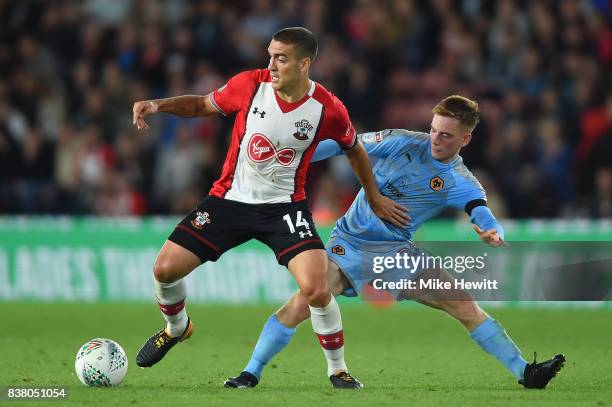 Oriol Romeu of Southampton is challenged by Connor Ronan of Wolves during the Carabao Cup Second Round match between Southampton and Wolverhampton...