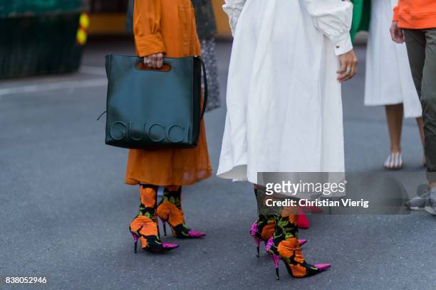 Guest wearing Gucci bag and Balenciaga sock boots with floral print outside FWSS on August 23, 2017 in Oslo, Norway.