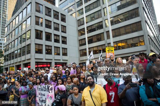 Activists rally in support of NFL quarterback Colin Kaepernick outside the offices of the National Football League on Park Avenue, August 23, 2017 in...