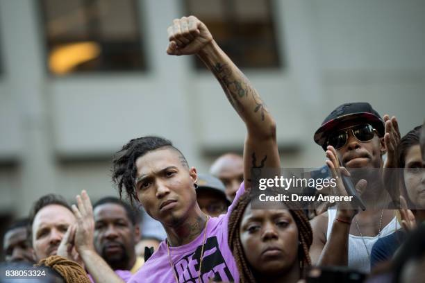 Activists rally in support of NFL quarterback Colin Kaepernick outside the offices of the National Football League on Park Avenue, August 23, 2017 in...