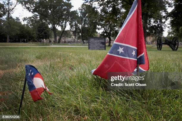 The first official flag of the Confederacy and a Confederate Navy Jack flag sit at the base of Confederate Mound, a memorial to more than 4,000...