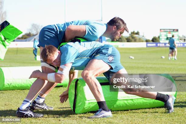 Kane Douglas and Dane Haylett-Petty undertake a training drill during an Australian Wallabies training session at Linwood Rugby Club on August 24,...
