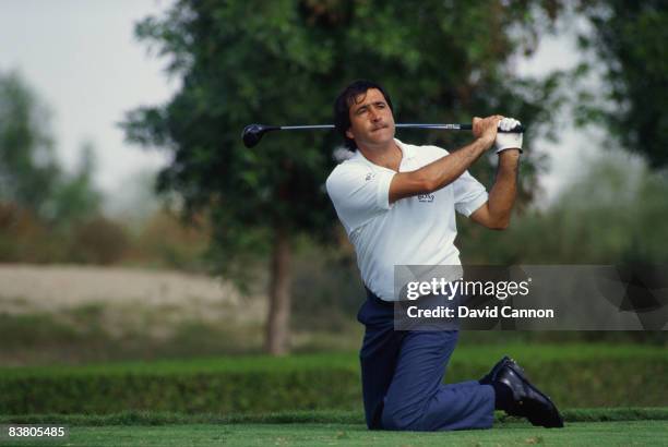 Spanish golfer Seve Ballesteros plays a trick shot during the Dubai Desert Classic at the Emirates Golf Club, Dubai, 1990.