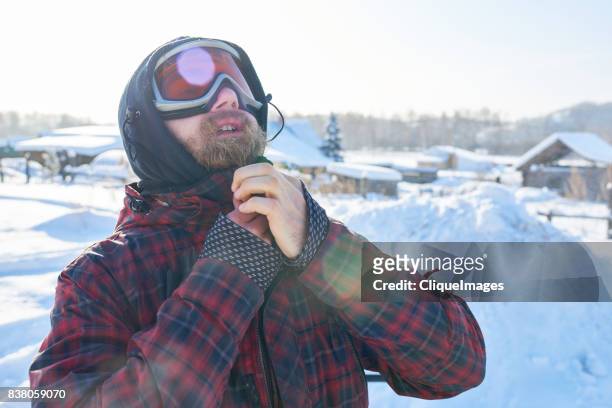 man preparing for winter ride - cliqueimages stock pictures, royalty-free photos & images