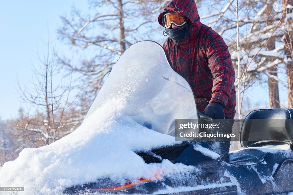 Snowmobiling on beautiful winter day