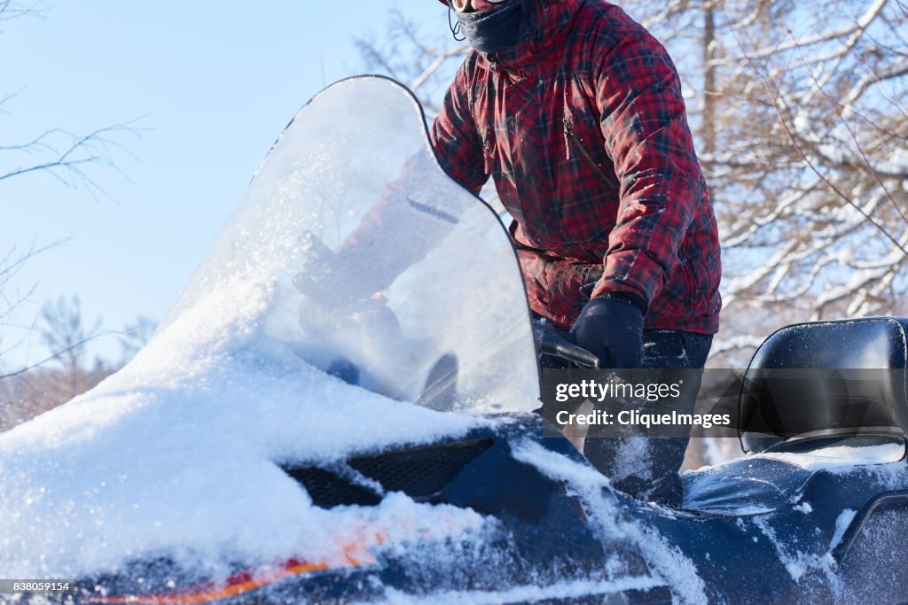 Experienced driver on snowmobile