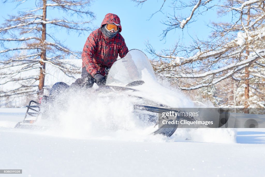 Man enjoying snowmobile ride