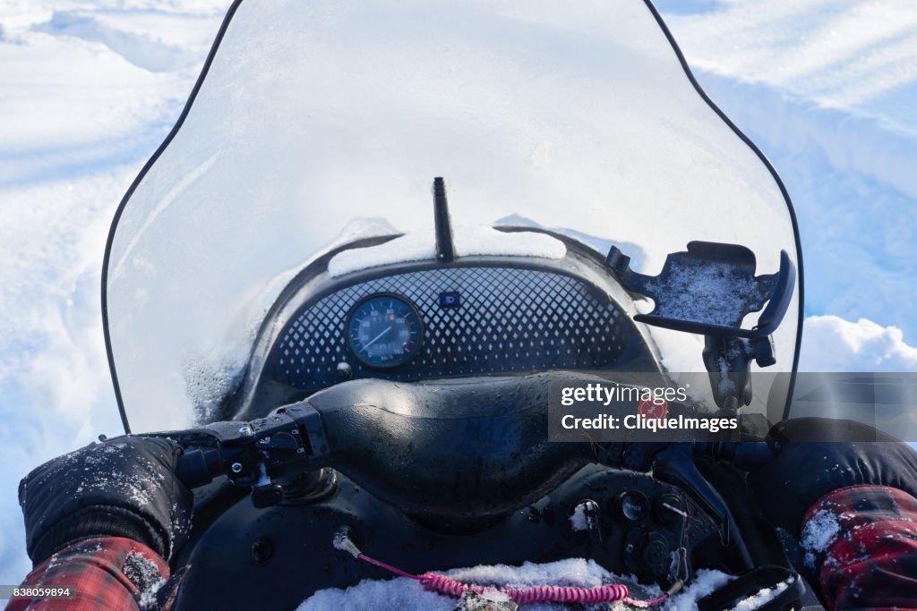 Man driving snowmobile