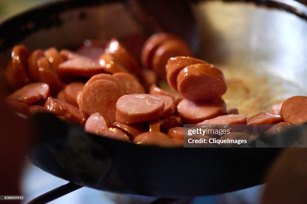 Delicious fried sausage in pan