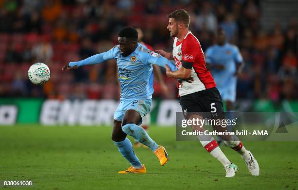 Nouha Dicko of Wolverhampton Wanderers and Jack Stephens of Southampton during the Carabao Cup Second Round match between Southampton and...