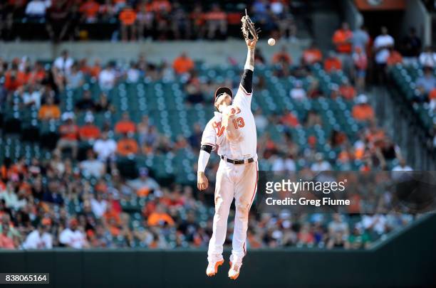 Manny Machado of the Baltimore Orioles misses a ball off the bat of Boog Powell of the Oakland Athletics in the sixth inning at Oriole Park at Camden...