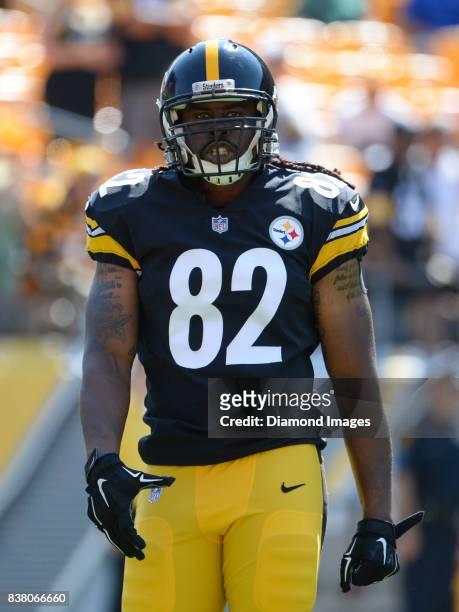 Tight end David Johnson of the Pittsburgh Steelers walks onto the field prior to a preseason game on August 20, 2017 against the Atlanta Falcons at...