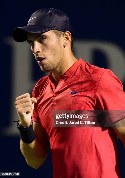 Borna Coric of Croatia reacts after winning his match against John Isner during the fifth day of the Winston-Salem Open at Wake Forest University on...