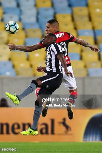 Paolo Guerrero of Flamengo struggles for the ball with Marcelo Conceio of Botafogo during a match between Flamengo and Botafogo part of Copa do...