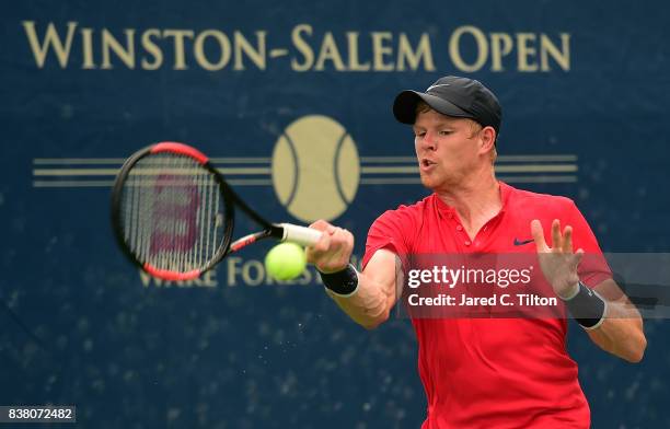 Kyle Edmund of Great Britain returns a shot to Marton Fucsovics of Hungary during the fifth day of the Winston-Salem Open at Wake Forest University...