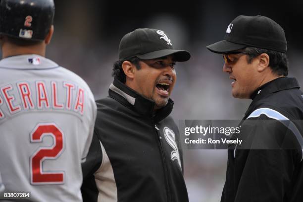 Manager Ozzie Guillen of the Chicago White Sox argues a call with first base umpire Mike Dimuro during the game against the Cleveland Indians at U.S....