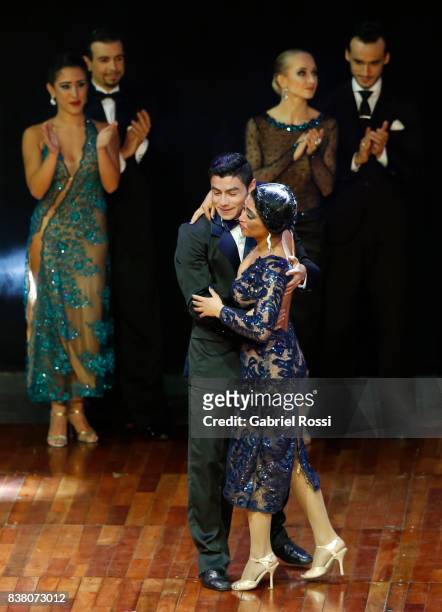 Valentin Arias Delgado and Diana Franco of Colombia celebrate after winning the third place during the final round of the Tango Stage competition as...
