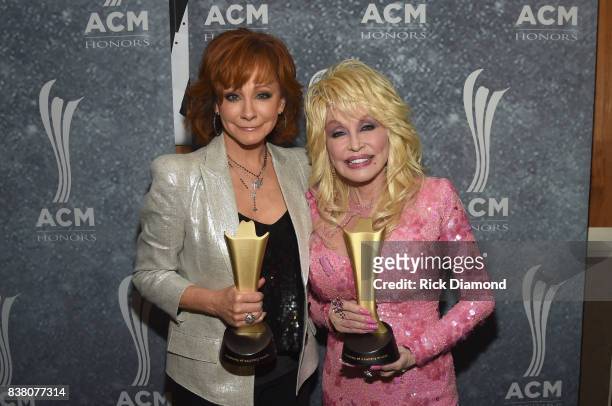 Honorees Reba McEntire and Dolly Parton attend the 11th Annual ACM Honors at the Ryman Auditorium on August 23, 2017 in Nashville, Tennessee.
