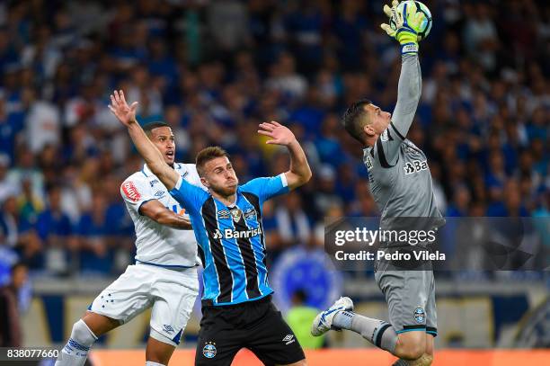 Murilo of Cruzeiro and Bressan and Marcelo Grohe of Gremio battle for the ball during a match between Cruzeiro and Gremio as part of Copa do Brasil...