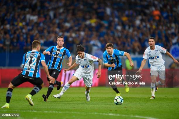 Hudson of Cruzeiro and Bressan and Arthur of Gremio battle for the ball during a match between Cruzeiro and Gremio as part of Copa do Brasil...