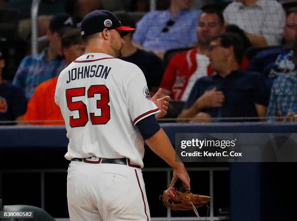 Jim Johnson of the Atlanta Braves looks to the stands after being pulled in the eighth inning against the Seattle Mariners at SunTrust Park on August...