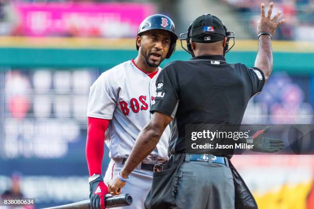 Eduardo Nunez of the Boston Red Sox complains about a called strike three by home plate umpire Alan Porter during the first inning against the...