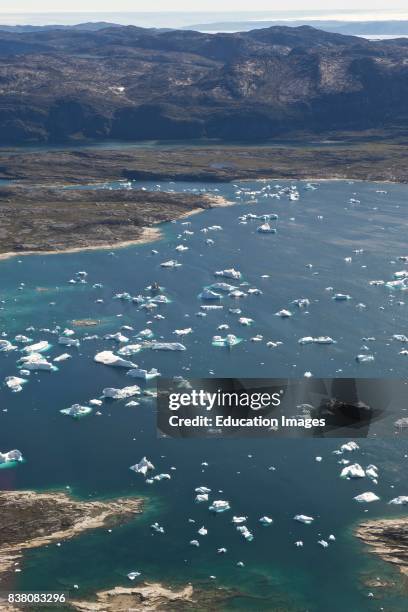 The huge icebergs in the Disko bay seem small from the view of a helicopter. These icebergs come from the Greenland ice sheet and can float very far...