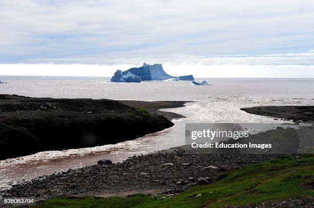 An iceberg floating in the Disko bay, just outside a melt water river coming from the Disko island.