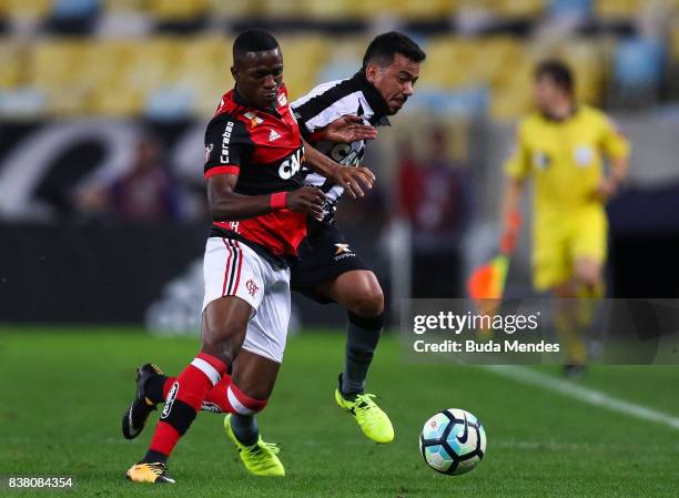 Vinicius Junior of Flamengo struggles for the ball with Rodrigo Lindoso of Botafogo during a match between Flamengo and Botafogo part of Copa do...
