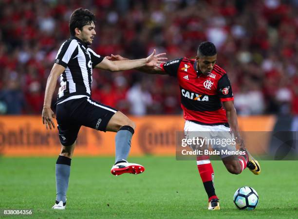 Orlando Berro of Flamengo struggles for the ball with Igor Rabello of Botafogo during a match between Flamengo and Botafogo part of Copa do Brasil...