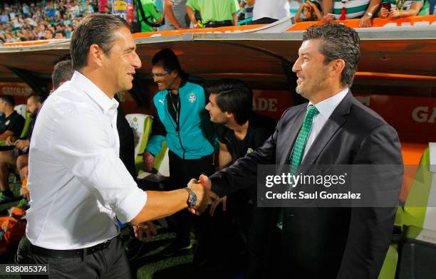 Gabriel Amato, coach of Chivas greets Jose Manuel de la Torre, coach of Santos, prior to the sixth round match between Santos Laguna and Chivas as...