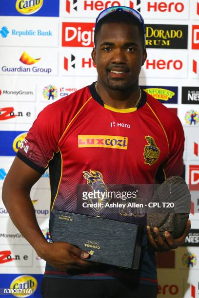 In this handout image provided by CPL T20, Darren Bravo of the Trinbago Knight Riders poses with his man of the match awards during Match 22 of the...