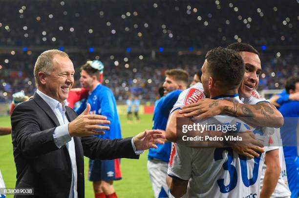 Mano Menezes coach and Thiago Neves and Bryan of Cruzeiro celebrates the result of the penalty against Gremio during a match between Cruzeiro and...