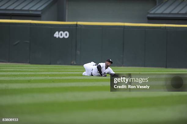 Ken Griffey Jr. Of the Chicago White Sox makes a spectacular diving catch on a ball hit by Jason Bartlett, avoiding a sliding Jermaine Dye, in the...