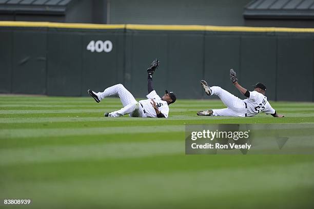 Ken Griffey Jr. Of the Chicago White Sox makes a spectacular diving catch on a ball hit by Jason Bartlett, avoiding a sliding Jermaine Dye, in the...
