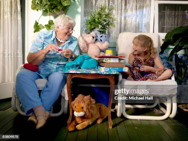 grandmother and grand daughter at home knitting - old granny knitting stock pictures, royalty-free photos & images