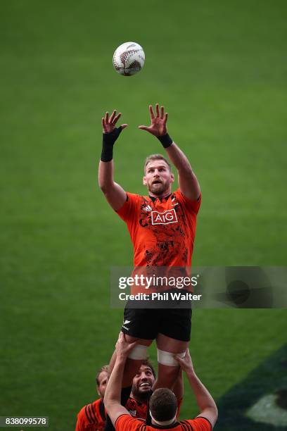 Kieran Read of the All Blacks takes the ball in the lineout during a New Zealand All Blacks training session at Forsyth Barr stadium on August 24,...