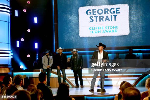 Jason Aldean, Alan Jackson, and Chris Stapleton present George Strait with the Cliffie Stone Icon Award onstage during the 11th Annual ACM Honors at...