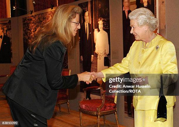 Queen Elizabeth II greets photographer Annie Leibovitz at a reception for American based in England at Buckingham Palace on March 27, 2007.